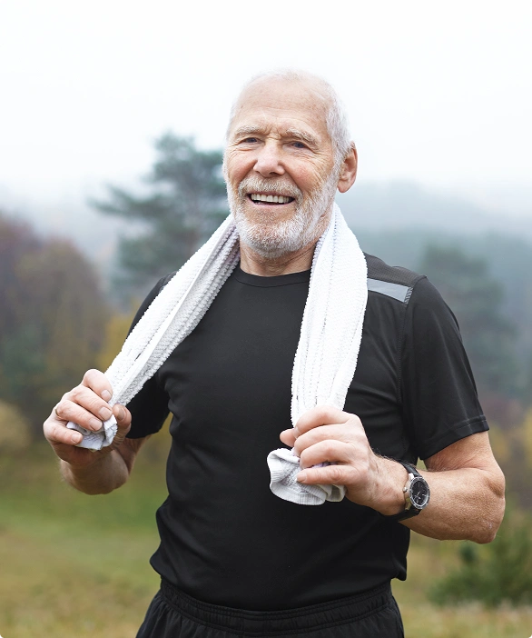 a-man-starching an old man wearing a towel in neck