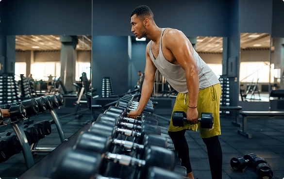 man-checking-dumbell