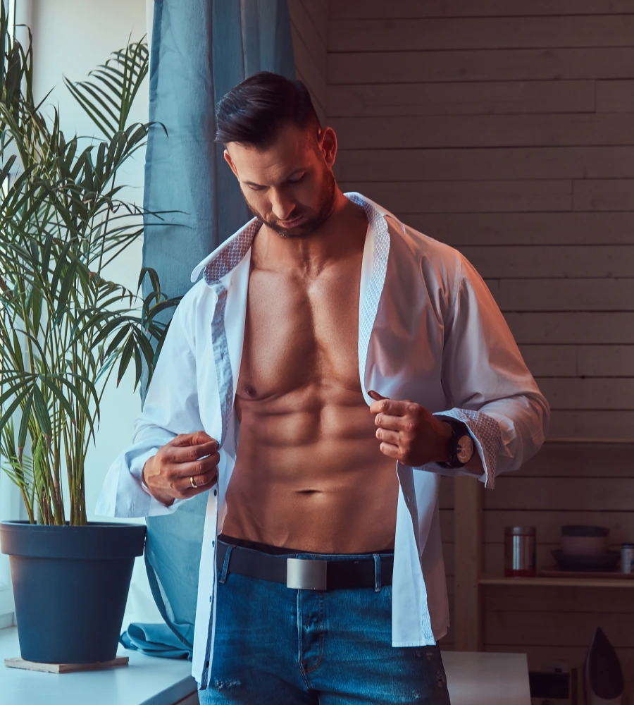 handsome-muscular-caucasian-male-dresses-white-shirt-near-window-morning handsome-muscular-caucasian-male-dresses-white-shirt-near-window-morning