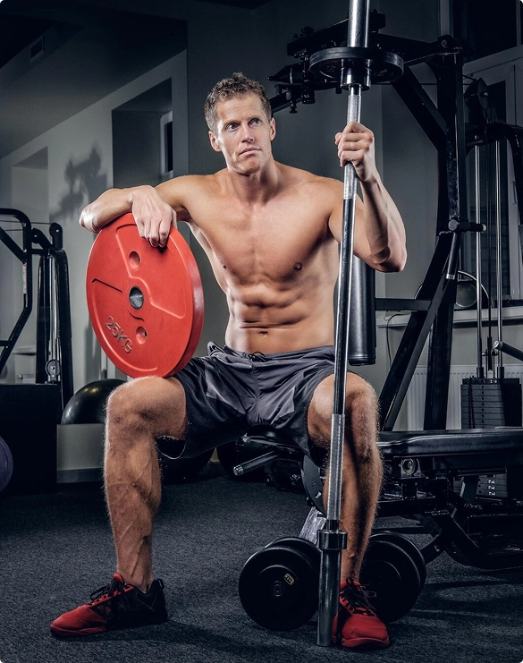 Shirtless athlete weight plates